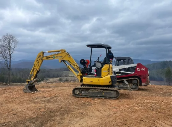 Excavator and compact track loader on a site-stabilization project