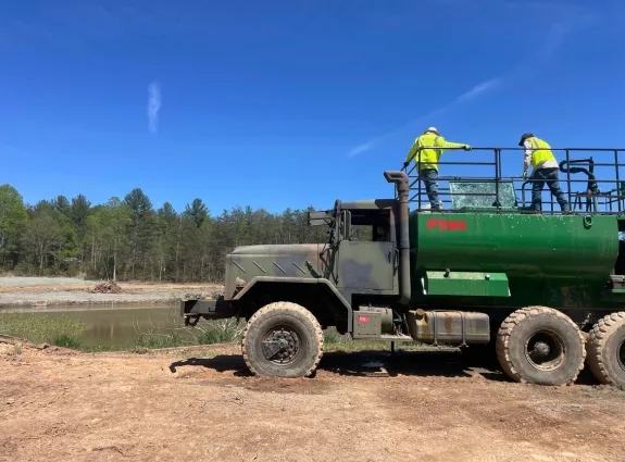 Tarheel Hydroseeding crew on a hydroseeding truck